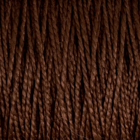 Close-up view of tightly coiled dark brown strands from Supreme Corp’s 3/2 Pearl Cotton Yarn | Mini-cone, showcasing a textured and rich fiber pattern. This versatile yarn is densely woven, creating a uniform appearance with subtle highlights and shadows.