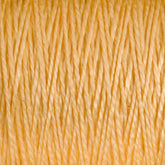 Close-up view of tightly woven 3/2 Pearl Cotton Yarn in golden yellow from Supreme Corp, showcasing its mercerized strands forming a textured pattern. The fibers are uniformly spaced, creating a consistent and intricate surface design that exudes warmth and vibrancy.