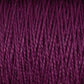 Experience a close-up view of the 3/2 Pearl Cotton Yarn | Mini-cone by Supreme Corp, showcasing its twisted strands of deep purple, mercerized cotton yarn. The texture is clearly visible, revealing tightly wound fibers with a slight sheen. The rich, vibrant color accentuates the pattern and intricacy of each individual strand.