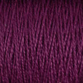 Experience a close-up view of the 3/2 Pearl Cotton Yarn | Mini-cone by Supreme Corp, showcasing its twisted strands of deep purple, mercerized cotton yarn. The texture is clearly visible, revealing tightly wound fibers with a slight sheen. The rich, vibrant color accentuates the pattern and intricacy of each individual strand.