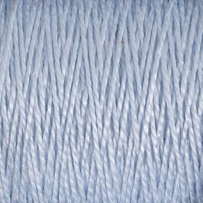 A close-up image of 3/2 Pearl Cotton Yarn from Supreme Corp highlights its tightly wound strands and textured surface. The light blue yarn appears soft, boasts uniform dyeing, and features a slightly glossy finish. This versatile yarn, available on a large cone, adds a delicate touch to any project.