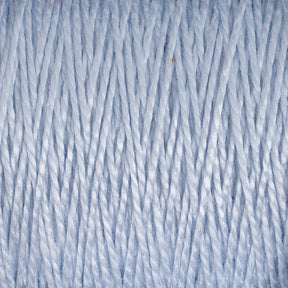 Close-up of tightly wound light blue 3/2 Pearl Cotton Yarn | Mini-cone by Supreme Corp. The individual fibers are visible, showing a textured and slightly shiny appearance. The image captures the repetitive, parallel strands, highlighting the intricate detail of this versatile material.