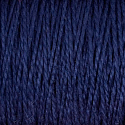 Close-up of dark blue, 3/2 Pearl Cotton Yarn from Supreme Corp. The mercerized cotton fibers appear tightly woven and have a subtle sheen, giving the yarn a smooth, almost glossy texture. The deep navy blue color is consistent throughout the image.