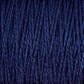 Close-up of tightly wound 3/2 Pearl Cotton Yarn from Supreme Corp, showcasing its textured, fibrous strands. This versatile mini-cone yarn appears soft and thick, with a rich, dark blue color that is consistent throughout.