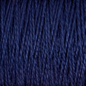 Close-up of tightly wound 3/2 Pearl Cotton Yarn from Supreme Corp, showcasing its textured, fibrous strands. This versatile mini-cone yarn appears soft and thick, with a rich, dark blue color that is consistent throughout.