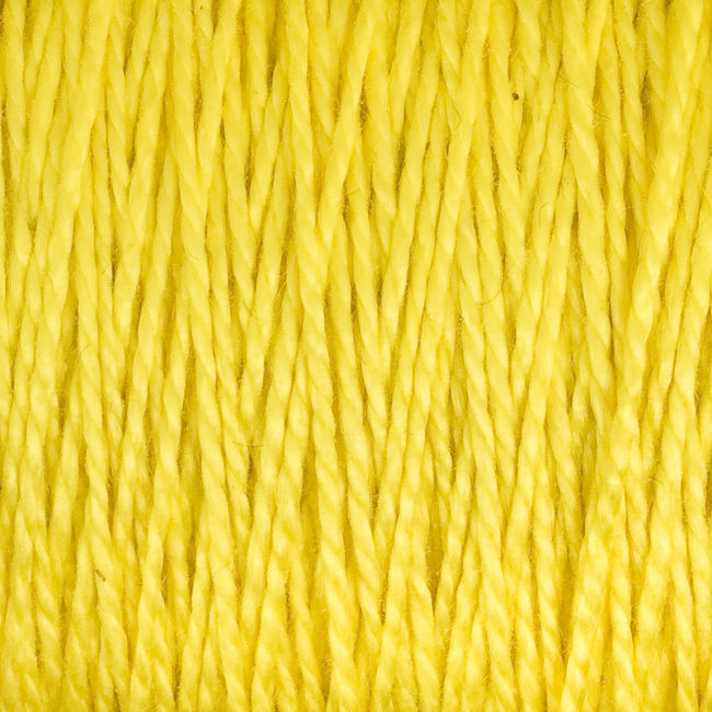 Close-up image of yellow strands of Supreme Corp's 3/2 Pearl Cotton Yarn (Large Cone) tightly aligned in a parallel arrangement, showcasing the texture and color detail of the fibers.