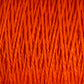 Close-up image of tightly woven, vibrant orange 3/2 Pearl Cotton Yarn fibers by Supreme Corp. The texture appears soft and thick, with individual strands clearly visible. The color is consistent throughout, creating a uniform and rich appearance.