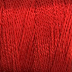 A close-up view of bright red, versatile 3/2 Pearl Cotton Yarn | Large Cone from Supreme Corp wound into a tight skein, with visible twisted fibers creating a textured pattern.