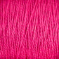 Close-up image of bright pink 3/2 Pearl Cotton Yarn from Supreme Corp, showcasing detailed texture and tightly wound strands on a large cone.