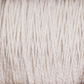 Close-up view of Supreme Corp's 3/2 Pearl Cotton Yarn wound tightly around a large cone. The fibers of the pearl cotton are visible, giving it a textured appearance. The yarn appears soft and slightly uneven in thickness.