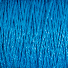 Close-up of bright blue 3/2 Pearl Cotton Yarn from Supreme Corp strands. The yarn appears tightly twisted and slightly shiny, creating a uniform, textured pattern throughout the image. The vibrant color and close-up perspective highlight the intricate details of this versatile yarn's fibers on a large cone.