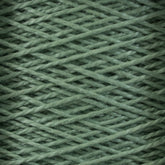 Close-up image of Supreme Corp's 3/2 Pearl Cotton Yarn from the Large Cone, wound in a criss-cross pattern, creating a textured and detailed surface. The fibers appear soft and slightly fuzzy, suggesting a comfortable and cozy material. This versatile yarn, made of mercerized cotton, offers a consistent green color for a uniform appearance.