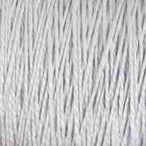 Close-up image of tightly wound, soft, white 3/2 Pearl Cotton Yarn from Supreme Corp. The fibers are evenly aligned, creating a textured and cozy appearance. This mercerized cotton yarn has a slight sheen, highlighting its smooth and delicate texture on the mini-cone.