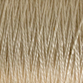 A close-up image of the 3/2 Pearl Cotton Yarn | Large Cone from Supreme Corp showcases tightly wound beige fibers with a slightly shiny texture. The thread is neatly aligned, highlighting its even and smooth surface along with subtle color variations.