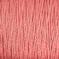 Close-up of Supreme Corp's 3/2 Pearl Cotton Yarn | Mini-cone in a warm, consistent shade of pink, showcasing its tightly woven texture and individual strands twisted together. The surface appears soft and smooth, indicating that this versatile yarn is ideal for both knitting and crocheting.