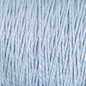 Close-up of 3/2 Pearl Cotton Yarn | Mini-cone in light blue by Supreme Corp. The image shows tightly spun strands with a soft, textured appearance, creating a pattern of parallel lines. The yarn appears fluffy and slightly reflective, suggesting it might be a synthetic or blended material.