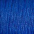 Close-up image of a textured, bright blue surface with strands resembling Supreme Corp's 3/2 Pearl Cotton Yarn from the large cone running vertically.