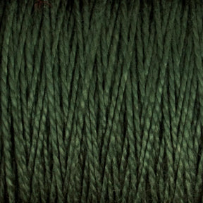 Close-up image of Supreme Corp's 3/2 Pearl Cotton Yarn in dark green, mercerized strands tightly aligned and textured, showcasing the fibers and twists in detail on a large cone.