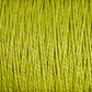 Close-up image of strands of bright green 3/2 Pearl Cotton Yarn from Supreme Corp, densely packed together, creating a textured and vibrant pattern. The fibers appear smooth and slightly shiny, showcasing the intricate and uniform weave of this versatile Large Cone yarn.