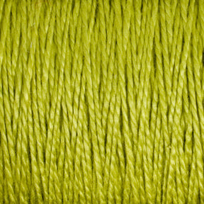 Close-up image of strands of bright green 3/2 Pearl Cotton Yarn from Supreme Corp, densely packed together, creating a textured and vibrant pattern. The fibers appear smooth and slightly shiny, showcasing the intricate and uniform weave of this versatile Large Cone yarn.