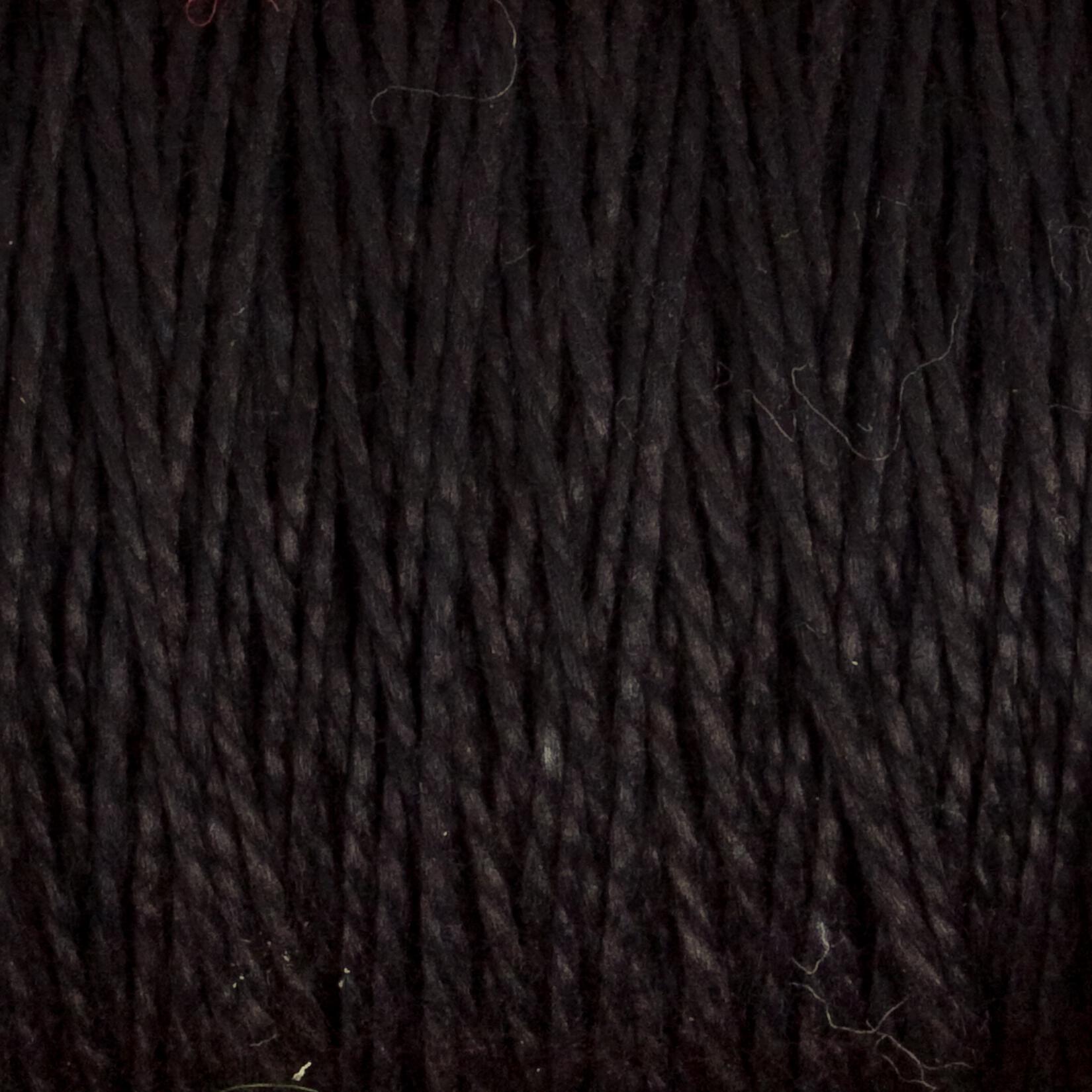 Close-up of Supreme Corp's 5/2 Pearl Cotton Yarn, shown tightly woven together on a large cone, highlighting the individual dark brown strands with subtle variations in shade and texture.