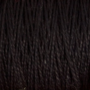 A close-up of black Supreme Corp's 5/2 Pearl Cotton Yarn tightly wound into a mini-cone, showcasing the texture and strands. The yarn appears thick and has a slightly glossy finish, with a few stray fibers visible—perfect for weaving projects.