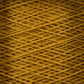 Close-up image of vibrant, orange-yellow 5/2 Pearl Cotton Yarn from Supreme Corp, wound tightly in a crisscross pattern, creating a textured, intricate surface. The yarn strands overlap and intersect on the large cone, producing a detailed, woven appearance.