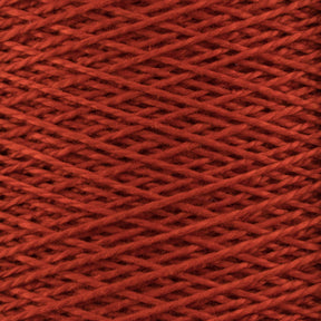 Close-up of a spool of Supreme Corp's 5/2 Pearl Cotton Yarn in red, showcasing the tightly packed crisscross pattern of the threads. The texture appears soft and slightly fuzzy, with a deep rich hue. The image highlights the intricate details and uniformity, making it perfect for delicate weaving projects.