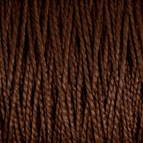 A close-up image of Supreme Corp's 5/2 Pearl Cotton Yarn on a large cone, showcasing thick, dark brown strands tightly wound together into a textured pattern. The fibers have a slightly glossy appearance, which beautifully highlights their intertwined structure and depth, epitomizing the versatility of this exceptional yarn.