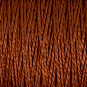 Close-up of a textured surface showing tightly wound, thick strands of brown 5/2 Pearl Cotton Yarn by Supreme Corp. The fibers twist and intertwine, creating a dense and prominent pattern. The lighting highlights the texture and depth of the versatile yarn from the Large Cone, reminiscent of finely spun Pearl Cotton.