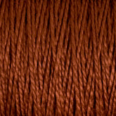 A close-up shot showcases the tightly wound, rust-colored 5/2 Pearl Cotton Yarn from Supreme Corp. The mercerized cotton fibers are twisted and display a rich, earthy brown hue, forming a dense and textured pattern. The focus on the details of the individual strands and their interwoven structure makes this mini-cone yarn perfect for weaving projects.