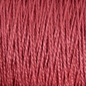 Close-up of Supreme Corp's 5/2 Pearl Cotton Yarn | Mini-cone in a pink hue, showing intertwined fibers. The texture appears soft and slightly shiny, as you would expect from mercerized cotton yarn. Individual strands of the Pearl Cotton are clearly visible, emphasizing the intricate details and smoothness ideal for weaving projects.