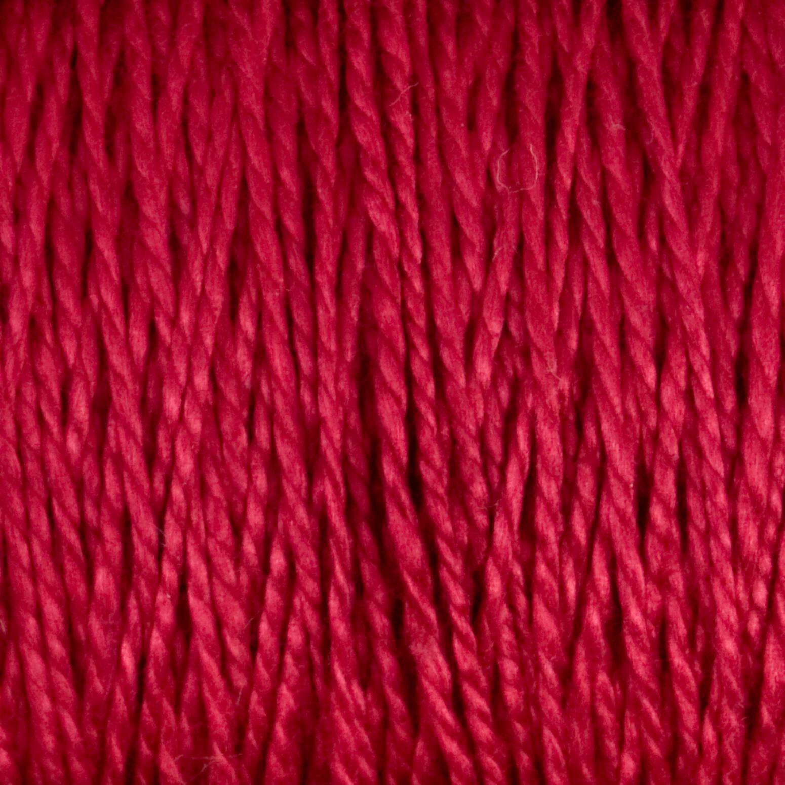 Close-up image of a bundle of tightly wound 5/2 Pearl Cotton Yarn from Supreme Corp. The yarn, displayed on a large cone, features a smooth texture with a slight shine. The individual strands are clearly visible, creating an intricate pattern of vertical lines in vibrant red.