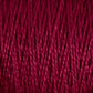 Close-up image of thick, red 5/2 Pearl Cotton Yarn from Supreme Corp, tightly wound in a parallel pattern on a large cone. The yarn has a rich, deep color and a slightly shiny texture, revealing individual twisted strands that provide a sense of both warmth and softness.