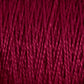 A close-up image of deep red 5/2 Pearl Cotton Yarn from Supreme Corp. The strands are tightly twisted and packed closely together, showcasing the texture and vibrant hue of this Mini-cone yarn. The tight twists and rich color give a sense of warmth and softness, perfect for weaving projects.