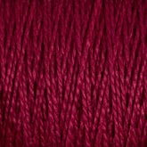 A close-up image of deep red 5/2 Pearl Cotton Yarn from Supreme Corp. The strands are tightly twisted and packed closely together, showcasing the texture and vibrant hue of this Mini-cone yarn. The tight twists and rich color give a sense of warmth and softness, perfect for weaving projects.