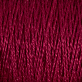 A close-up image of deep red 5/2 Pearl Cotton Yarn from Supreme Corp. The strands are tightly twisted and packed closely together, showcasing the texture and vibrant hue of this Mini-cone yarn. The tight twists and rich color give a sense of warmth and softness, perfect for weaving projects.