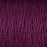 Close-up view of a purple skein of Supreme Corp's 5/2 Pearl Cotton Yarn | Large Cone, showcasing its tightly wound, fibrous texture and rich color. The strands are neatly aligned, emphasizing the material's smooth and soft appearance.