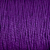 Close-up image of Supreme Corp's 5/2 Pearl Cotton Yarn | Large Cone in a rich and vibrant purple. The mercerized cotton strands are tightly wound together, highlighting the yarn’s smooth texture and slight shine in detailed view.