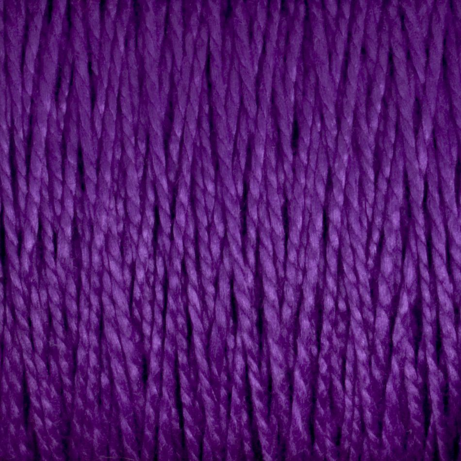 Close-up image of Supreme Corp's 5/2 Pearl Cotton Yarn | Large Cone in a rich and vibrant purple. The mercerized cotton strands are tightly wound together, highlighting the yarn’s smooth texture and slight shine in detailed view.