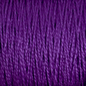 Close-up image of Supreme Corp's 5/2 Pearl Cotton Yarn | Large Cone in a rich and vibrant purple. The mercerized cotton strands are tightly wound together, highlighting the yarn’s smooth texture and slight shine in detailed view.