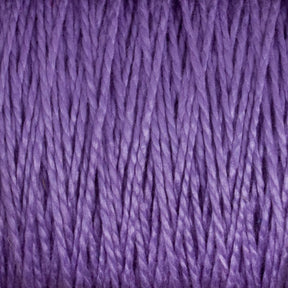 A close-up image of Supreme Corp's 5/2 Pearl Cotton Yarn | Large Cone in purple, showcasing detailed, tightly wound strands. The texture appears soft and smooth, with a consistent weave pattern throughout. The vibrant purple color gives a rich and uniform appearance to this versatile yarn.