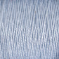 Close-up image of a spool of Supreme Corp's 5/2 Pearl Cotton Yarn in light blue. The fibers are tightly wound in a vertical pattern, showcasing the texture and slight sheen of the threads. This versatile large cone yarn appears soft and slightly fluffy, suitable for knitting or crochet projects.