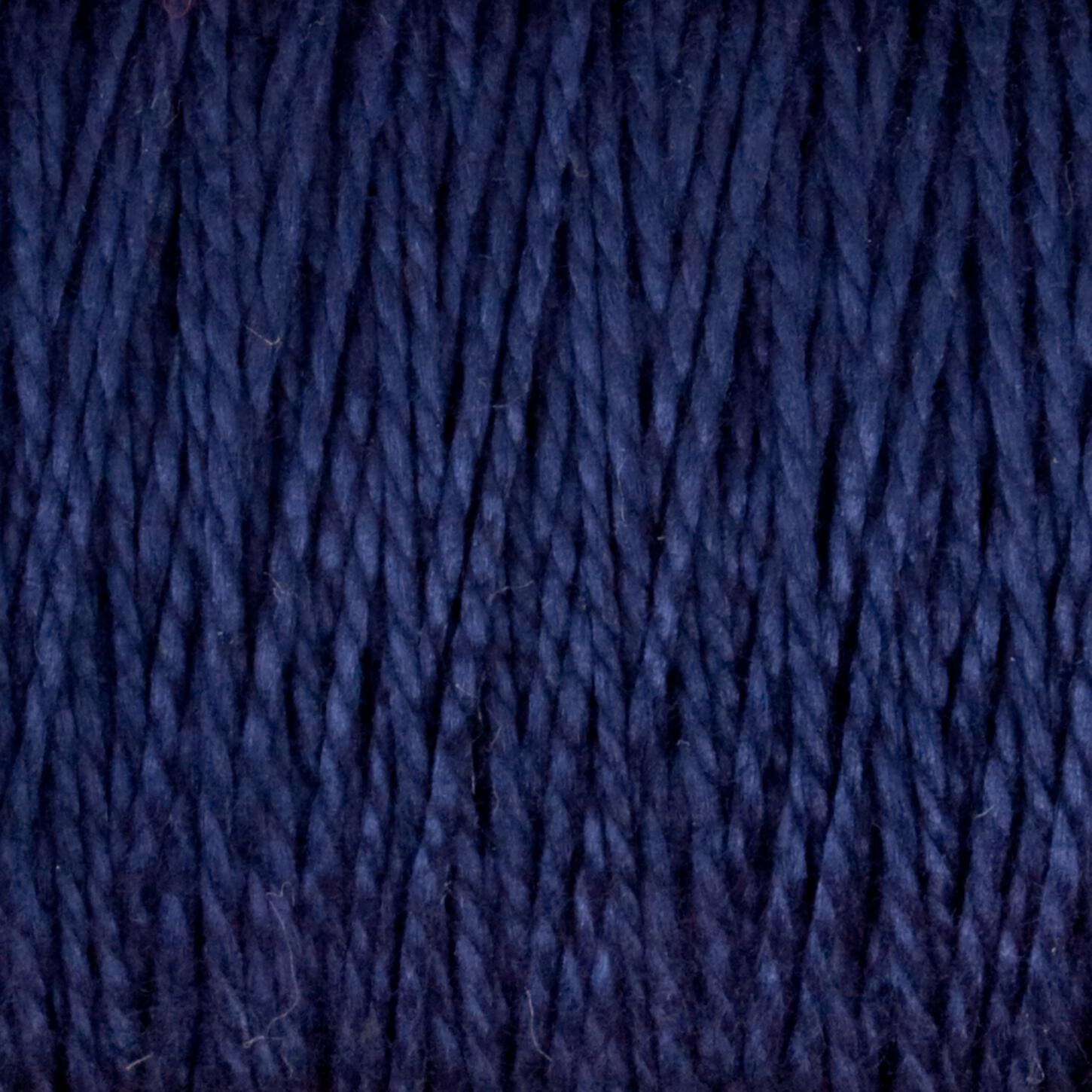 Close-up image of Supreme Corp's 5/2 Pearl Cotton Yarn | Large Cone in dark blue. The strands are closely packed and displayed vertically, showcasing a slightly textured, twisted pattern. This versatile yarn is deep and rich in color with subtle variations in shading, making it perfect for any project requiring quality materials.