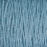 A close-up image of Supreme Corp's 5/2 Pearl Cotton Yarn | Large Cone in light blue, showcasing the detailed texture and individual strands twisted together. The material appears soft and smooth, with a consistent, evenly spun appearance that highlights the yarn's versatile quality and sheen.