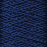 A close-up image of Supreme Corp's 5/2 Pearl Cotton Yarn in dark blue, wound tightly on a mini-cone. The threads are arranged in a crisscross pattern, creating a textured and detailed surface. The color is deep and rich, with subtle variations in the shade of blue due to the yarn's texture and lighting—perfect for weaving projects.