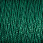 Close-up image of tightly wound, emerald green 5/2 Pearl Cotton Yarn from Supreme Corp, showcasing its smooth texture and slight shine. The fibers are uniform in thickness, creating a consistent and orderly pattern.