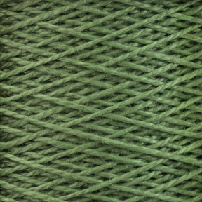 Close-up image of Supreme Corp's 5/2 Pearl Cotton Yarn | Large Cone in versatile green, wound tightly in a crisscross pattern to showcase the intricate texture and intertwined strands. The yarn appears soft and fuzzy, with slight variations in green shades.