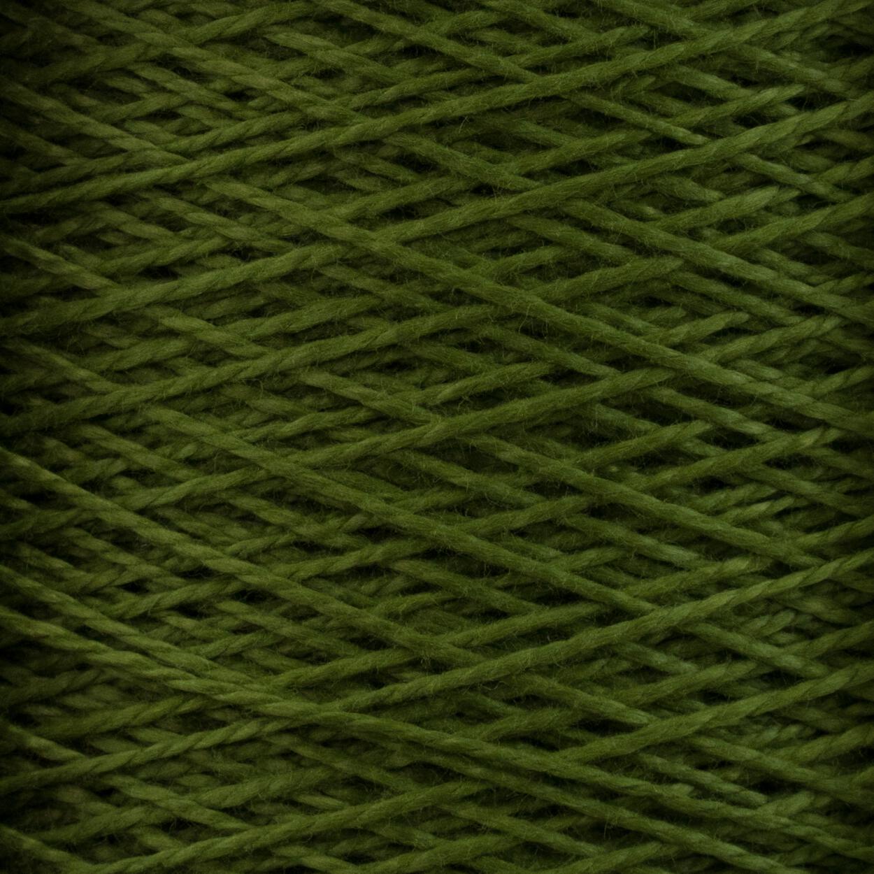 Close-up of tightly wound, 5/2 Pearl Cotton Yarn from Supreme Corp. The overlapping strands create a crisscross pattern. The texture appears soft and slightly fuzzy, with a rich, deep green color. This versatile yarn is ideal for various crafting projects and comes in a large cone.