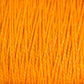 Close-up image of Supreme Corp's 5/2 Pearl Cotton Yarn | Large Cone, featuring tightly wound strands of bright orange mercerized cotton. The texture and vibrant color are prominently showcased, with individual fibers clearly visible, highlighting the smooth and slightly glossy surface of this versatile yarn.